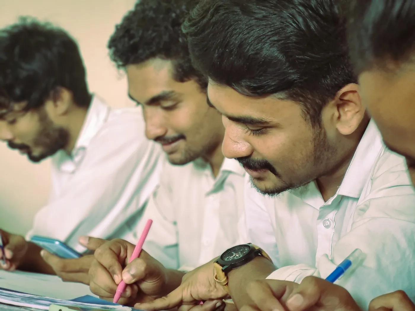 Engineering students taking notes in class